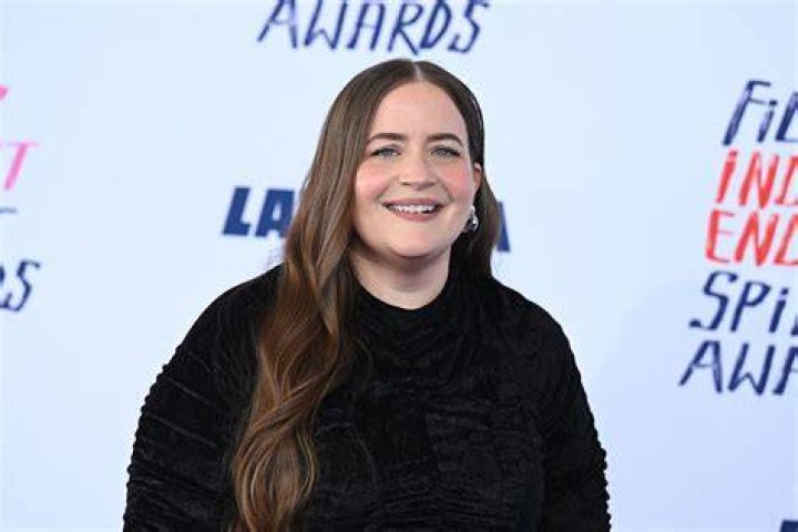 Aidy Bryant on 'Shrill' laughing, holding a dinner knife