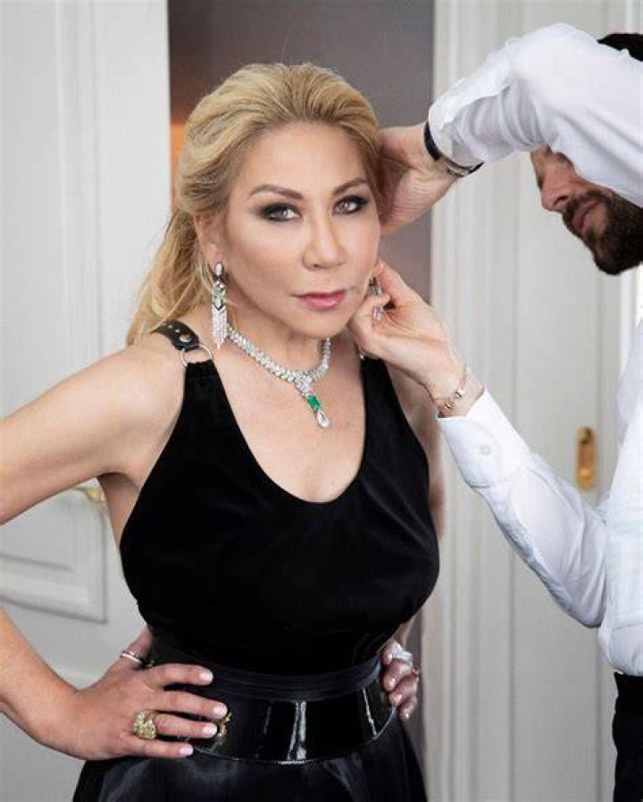 Anna Shay from 'Bling Empire' in a gold dress at an event for the show. Shay is survived by her son, but she didn't have a husband at the time of her death.