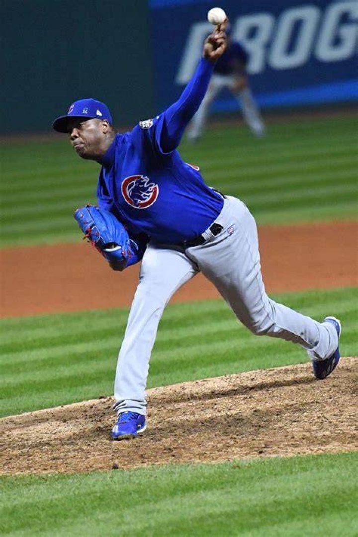 Chicago Cubs relief pitcher Aroldis Chapman (left) talks with catcher Miguel Montero (right) in the 9th inning against the Cleveland Indians in game seven of the 2016 World Series at Progressive Field. Photo by Ken Blaze/USA TODAY Sports 