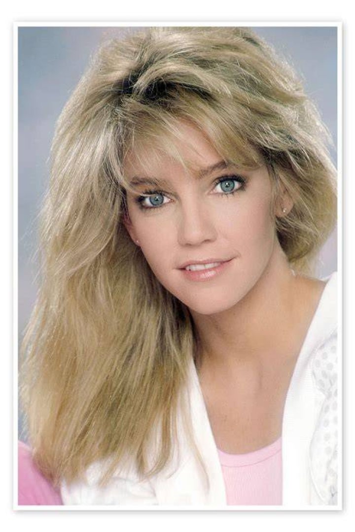 Heather Locklear toasts with a glass of champagne while standing next to Jason MacDonald in 'Don't Sweat the Small Stuff: The Kristine Carlson Story'