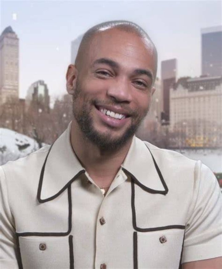Kendrick Sampson wears a light-colored jacket with black and red designs at an event for the show 'Insecure'