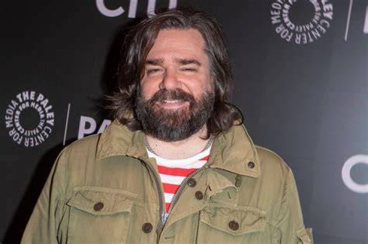 Matt Berry yells bat in What We Do in the Shadows. Laszlo stands outside holding an apple.