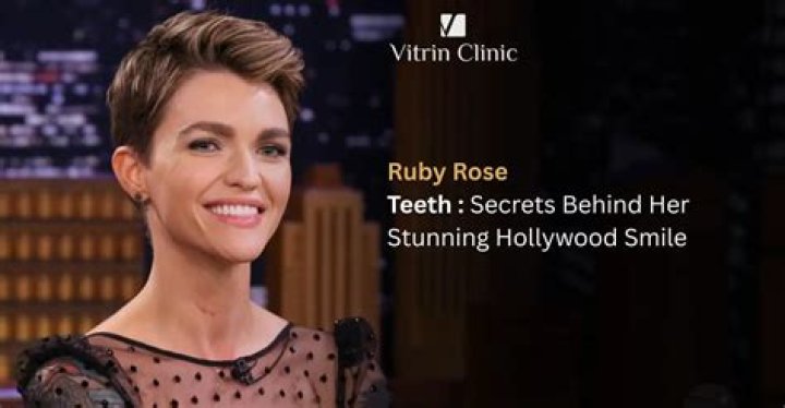 Ruby Rose Ruby Rose smiles and holds up her arm