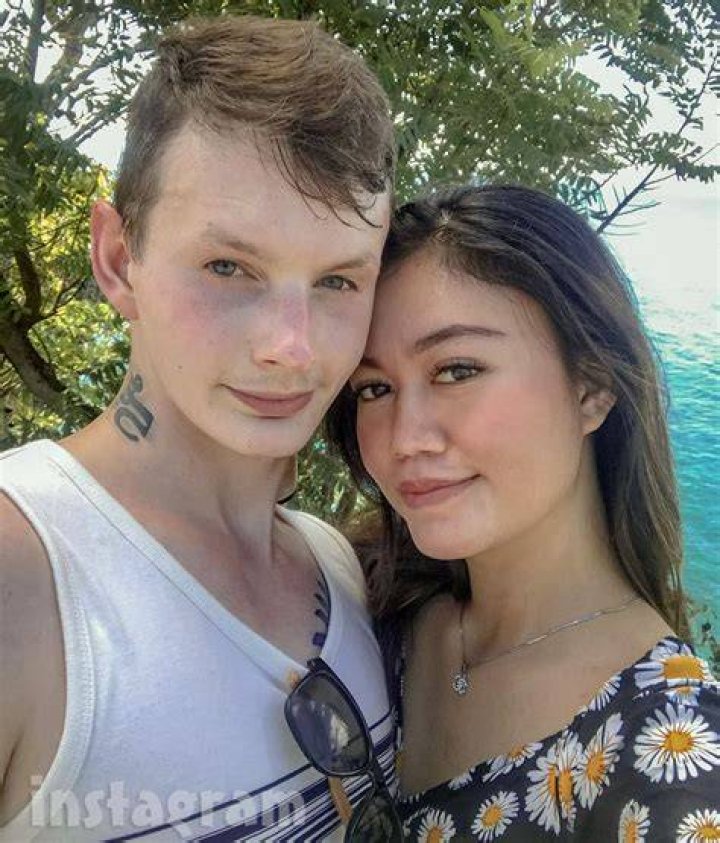 Sam and Citra from '90 Day Fiance' with their arms around each other