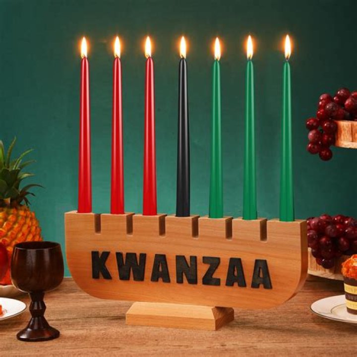 Someone with Kwanzaa candles